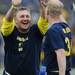 Jerry Haynes high fives Phil Brabbs after a play during the Victors Classic alumni football game at Michigan Stadium on Saturday. Melanie Maxwell I AnnArbor.com